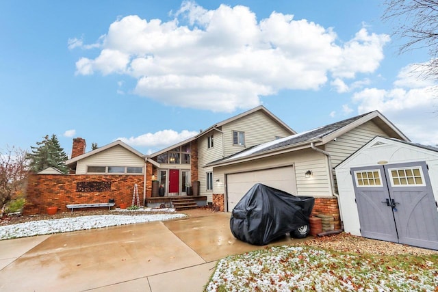 back of house with a garage