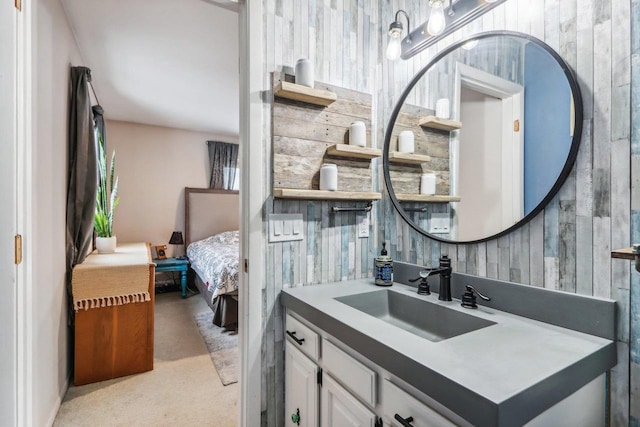 bathroom with wood walls and vanity