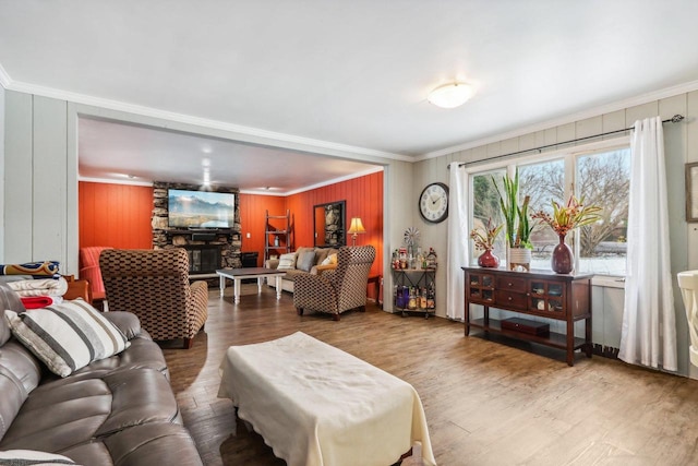 living room featuring hardwood / wood-style flooring and ornamental molding