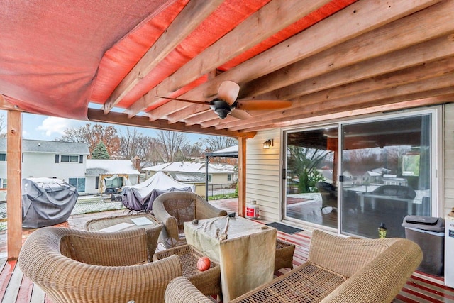 wooden deck with outdoor lounge area, area for grilling, and ceiling fan