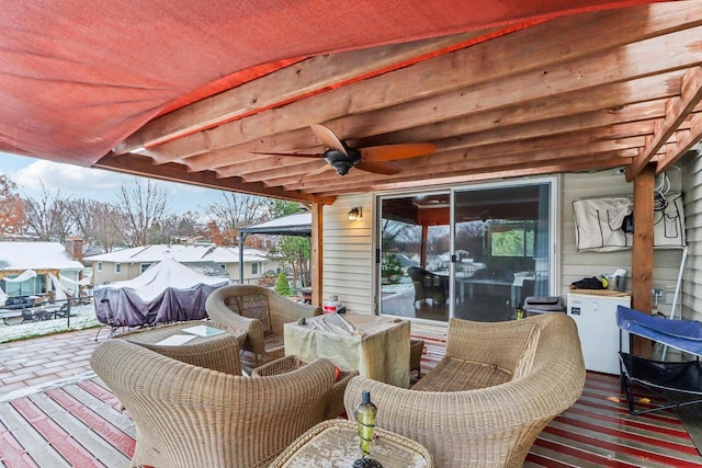 wooden deck featuring a patio area and ceiling fan