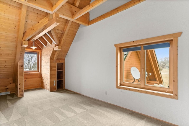 bonus room with vaulted ceiling with beams, wooden ceiling, and light carpet