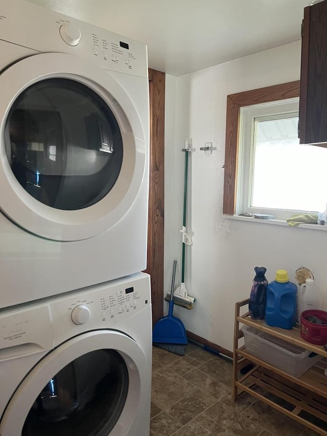 laundry room with stacked washer and dryer