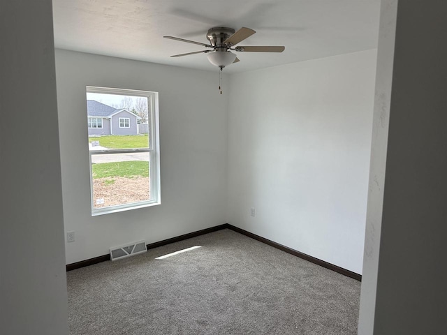 unfurnished room featuring carpet floors and ceiling fan