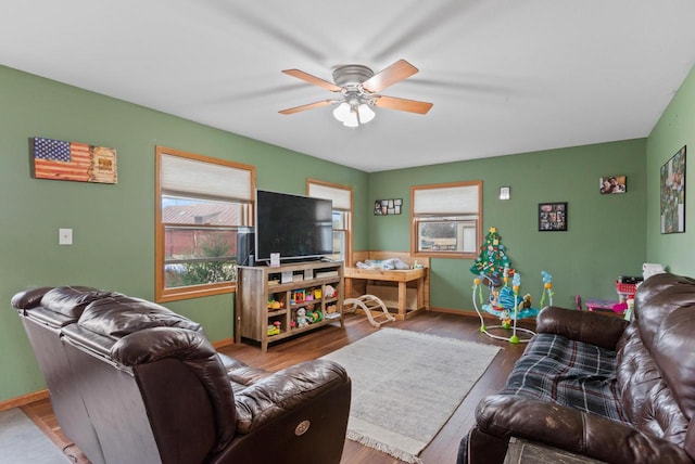 living room with ceiling fan and light wood-type flooring