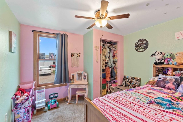 bedroom featuring a closet, ceiling fan, and light colored carpet