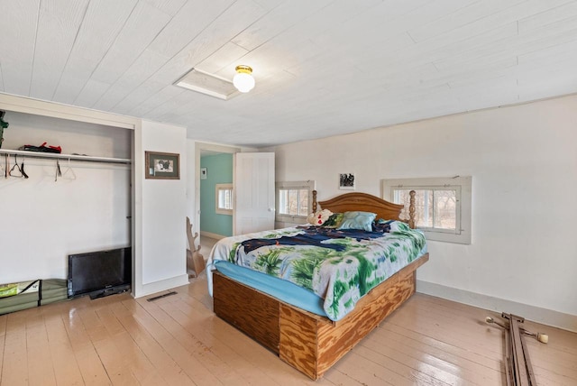 bedroom featuring light hardwood / wood-style flooring and a closet