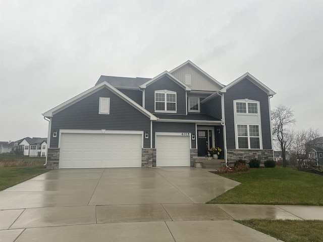 craftsman-style home with a garage and a front lawn