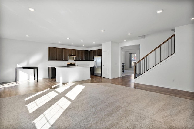 unfurnished living room featuring wood-type flooring