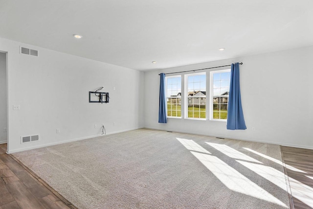 empty room with light hardwood / wood-style floors