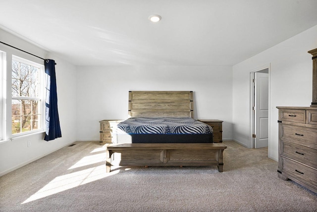 bedroom with light carpet