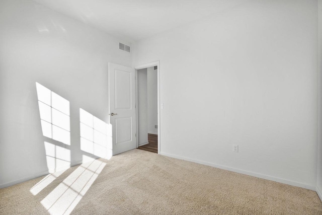 spare room with light colored carpet