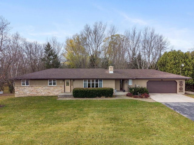 ranch-style house with a front yard and a garage