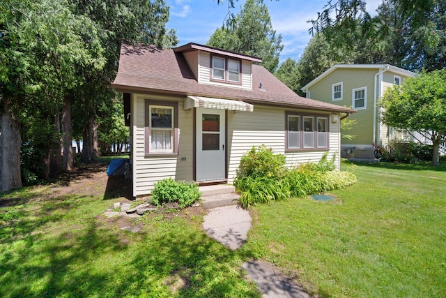 bungalow with a front lawn