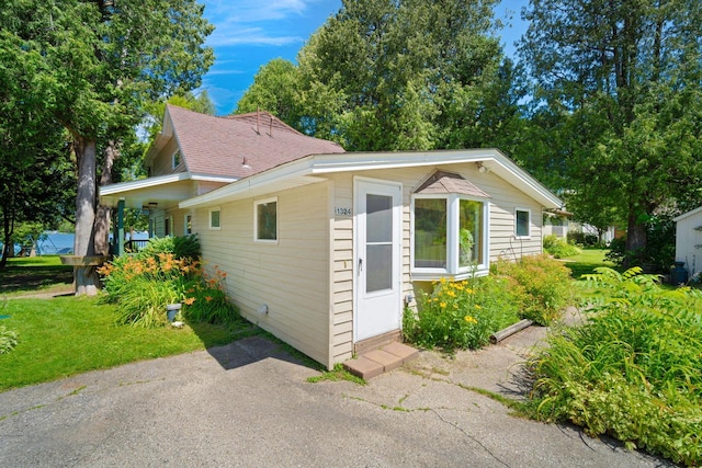 view of property exterior featuring a yard