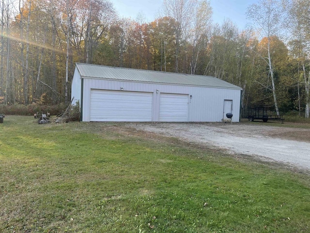 garage featuring a yard