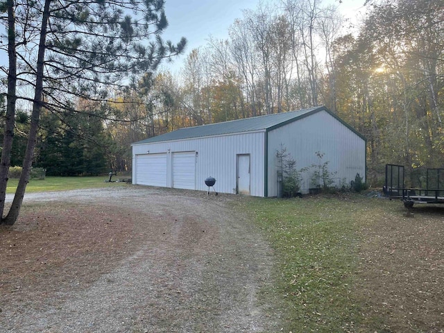 view of outbuilding with a garage