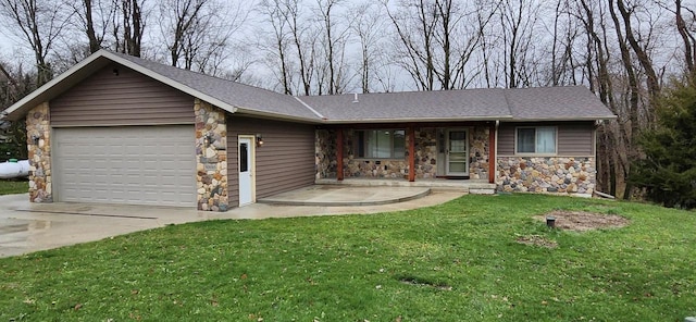 ranch-style home with a front yard and a garage