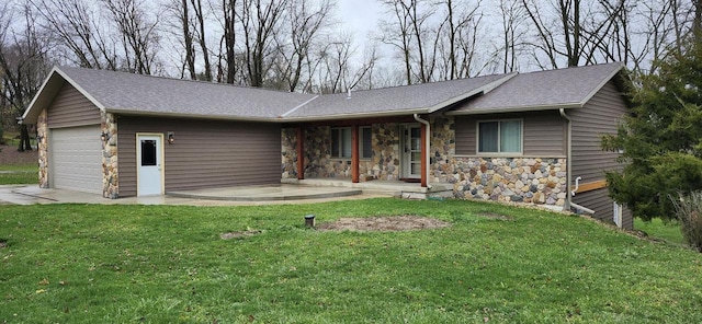 single story home with covered porch, a front yard, and a garage