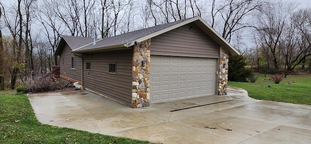 garage with a lawn