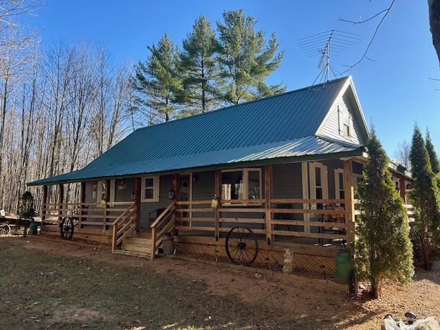 farmhouse inspired home with a porch