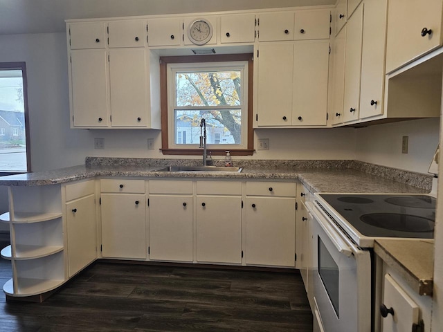 kitchen featuring white cabinetry, dark hardwood / wood-style flooring, electric range, and sink