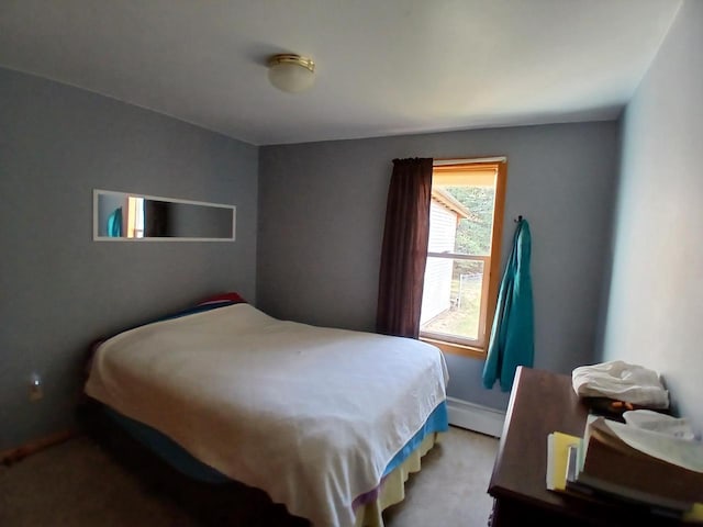 bedroom featuring light colored carpet and a baseboard radiator