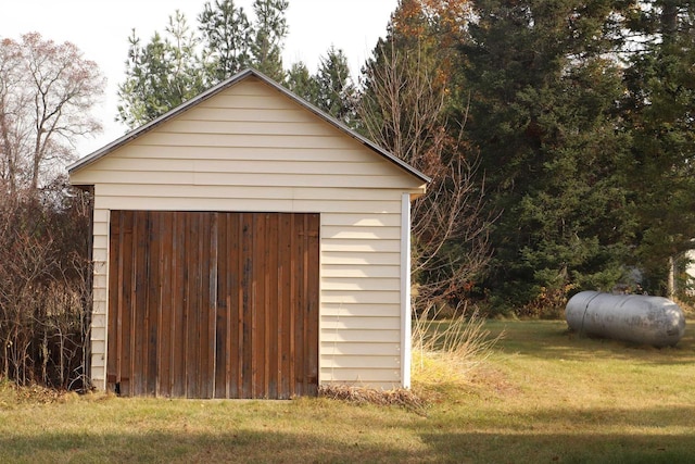 view of outbuilding with a lawn