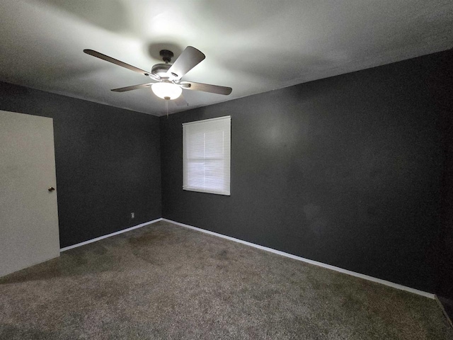 empty room featuring carpet floors and ceiling fan