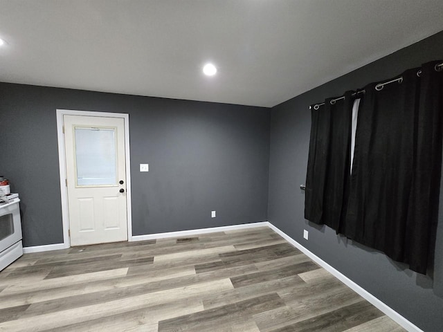 spare room with light hardwood / wood-style flooring