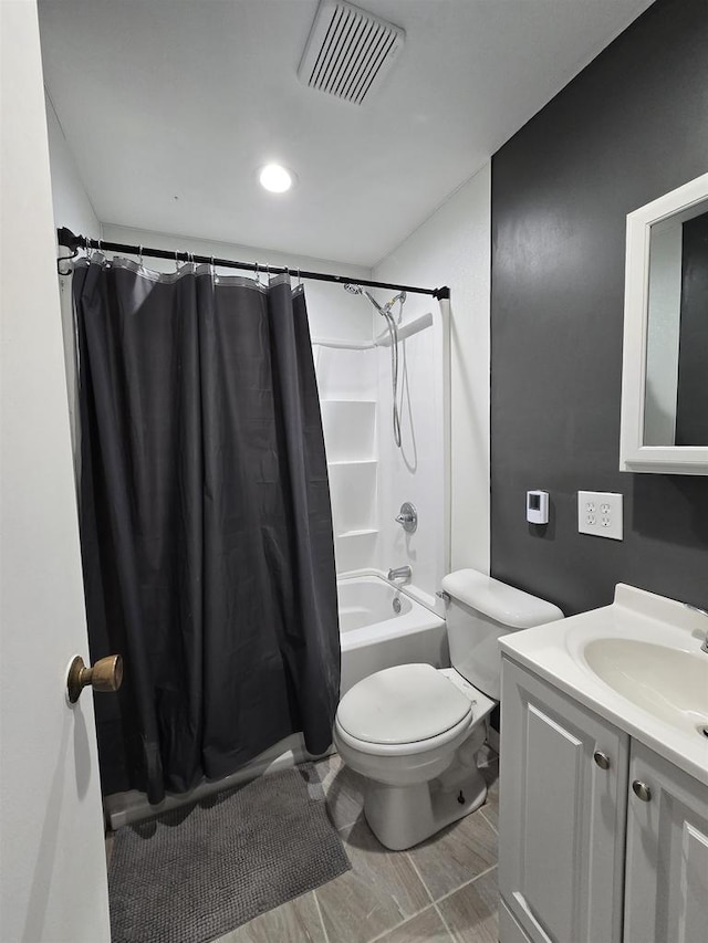 full bathroom with vanity, toilet, and shower / bath combo with shower curtain