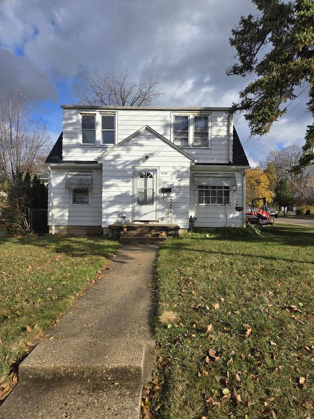 view of front of property with a front lawn