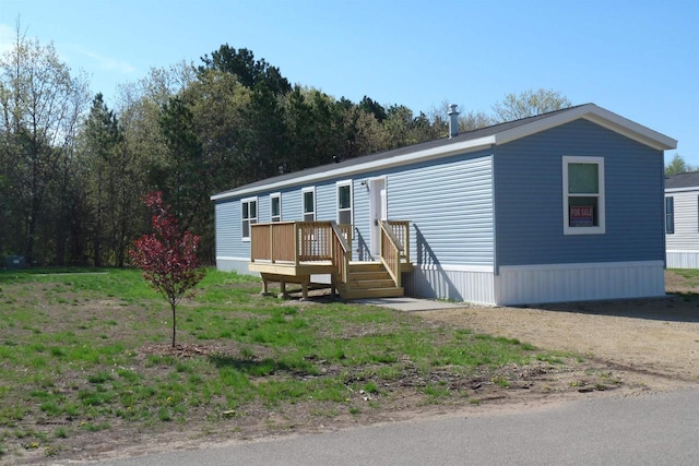 S13041 Shifflet Rd Unit 128, Spring Green, WI 53588 - manufactured / mobile home featuring a wooden deck