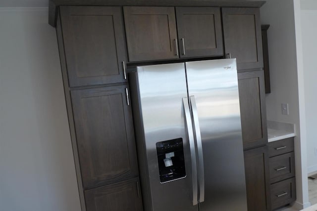 S13041 Shifflet Rd Unit 128, Spring Green, WI 53588 - kitchen with stainless steel fridge, light countertops, and baseboards