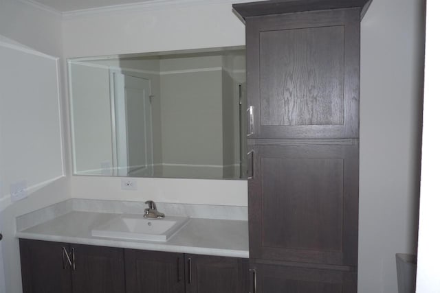 bathroom featuring vanity and crown molding