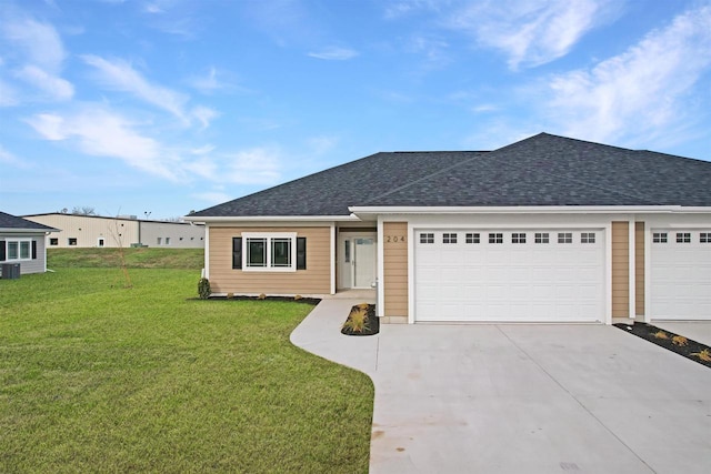 ranch-style home featuring a garage, central air condition unit, and a front yard