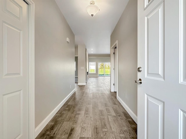 hall with light hardwood / wood-style floors