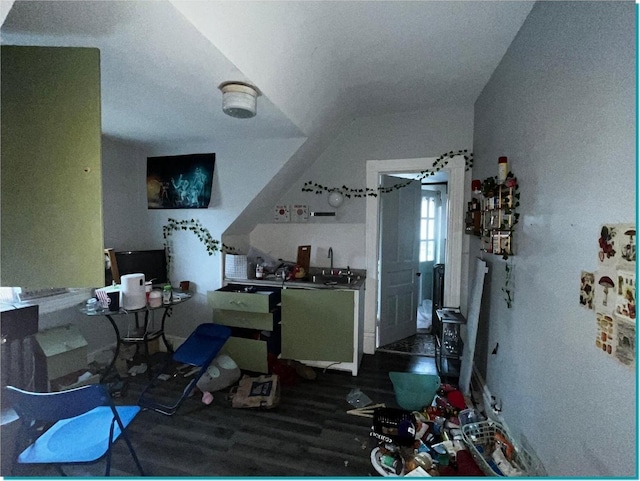 kitchen with lofted ceiling and hardwood / wood-style flooring