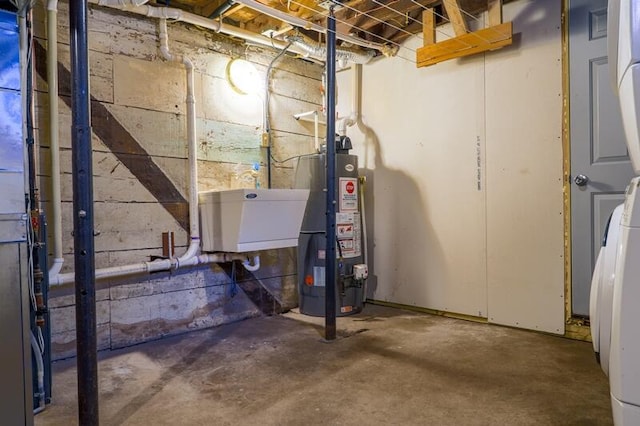 utility room featuring water heater and sink