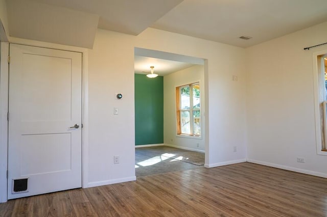 empty room featuring hardwood / wood-style flooring