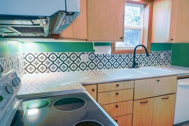 kitchen with white dishwasher, decorative backsplash, electric range oven, and sink