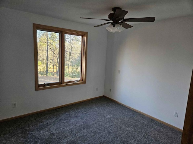 carpeted empty room with ceiling fan