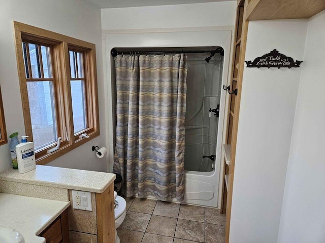 full bathroom with toilet, shower / tub combo, vanity, and tile patterned floors