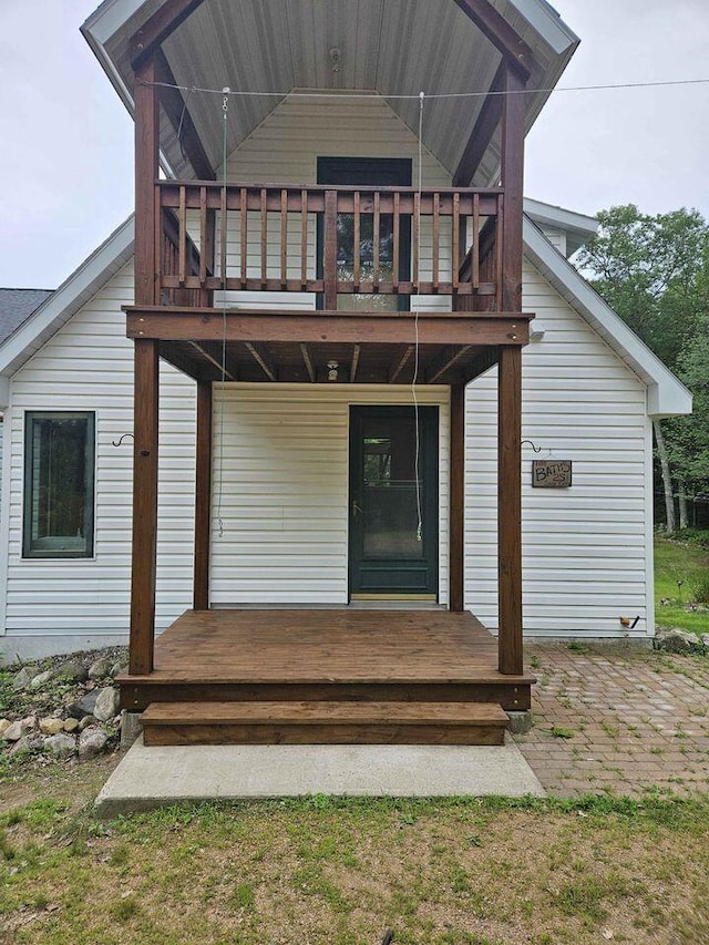 rear view of house featuring a balcony