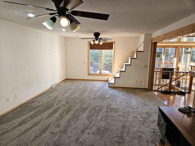 unfurnished living room featuring wood-type flooring and ceiling fan