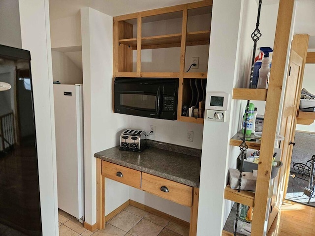 kitchen featuring light tile patterned flooring