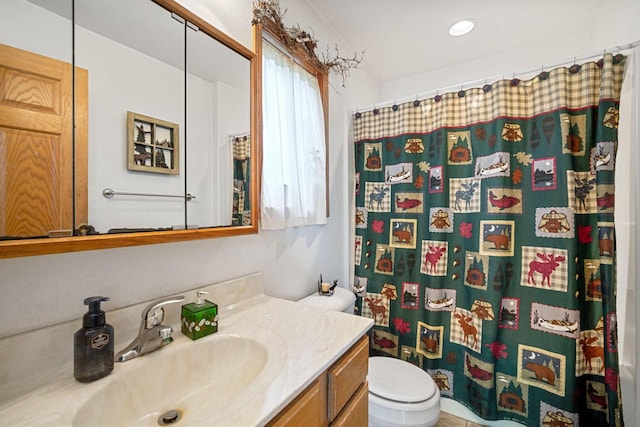 bathroom with vanity, a shower with shower curtain, and toilet