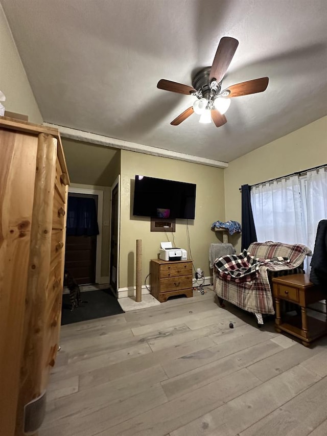 bedroom with light wood-type flooring and ceiling fan