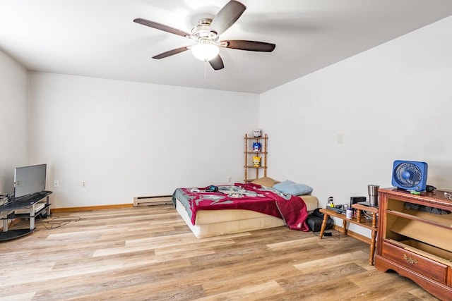 bedroom with light wood-type flooring, a baseboard radiator, and ceiling fan