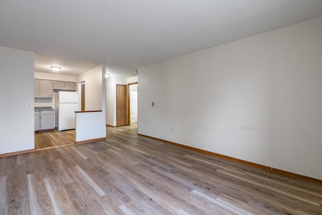 unfurnished living room featuring light hardwood / wood-style floors